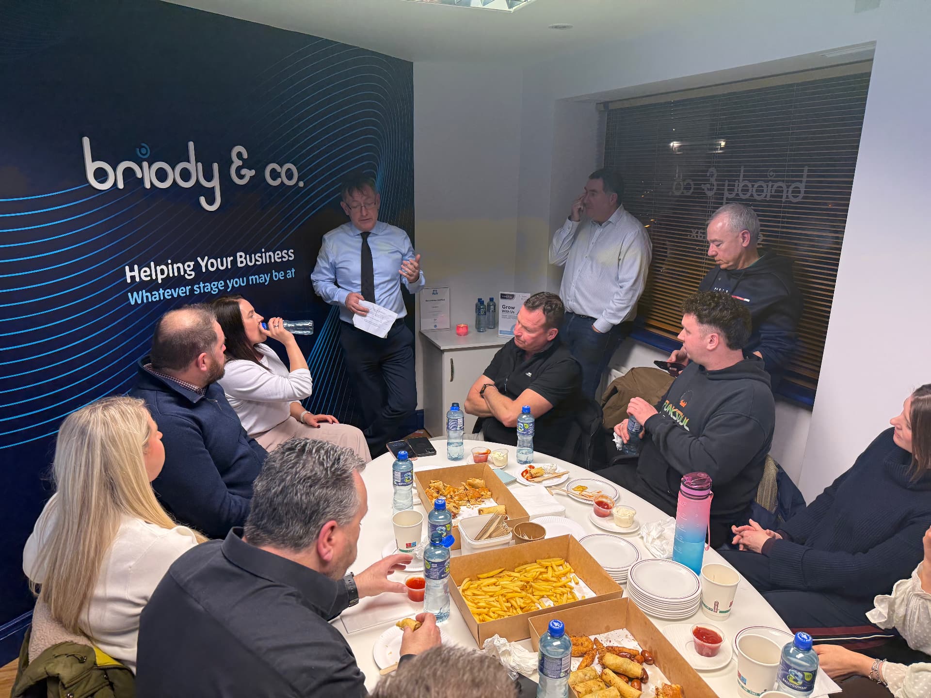 Members around a table at Briody & Co Chartered Accountants in Dundalk