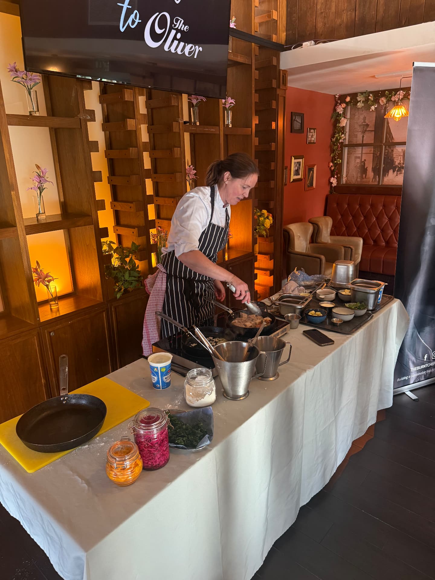 A chef cooking for members at The Oliver in Newry