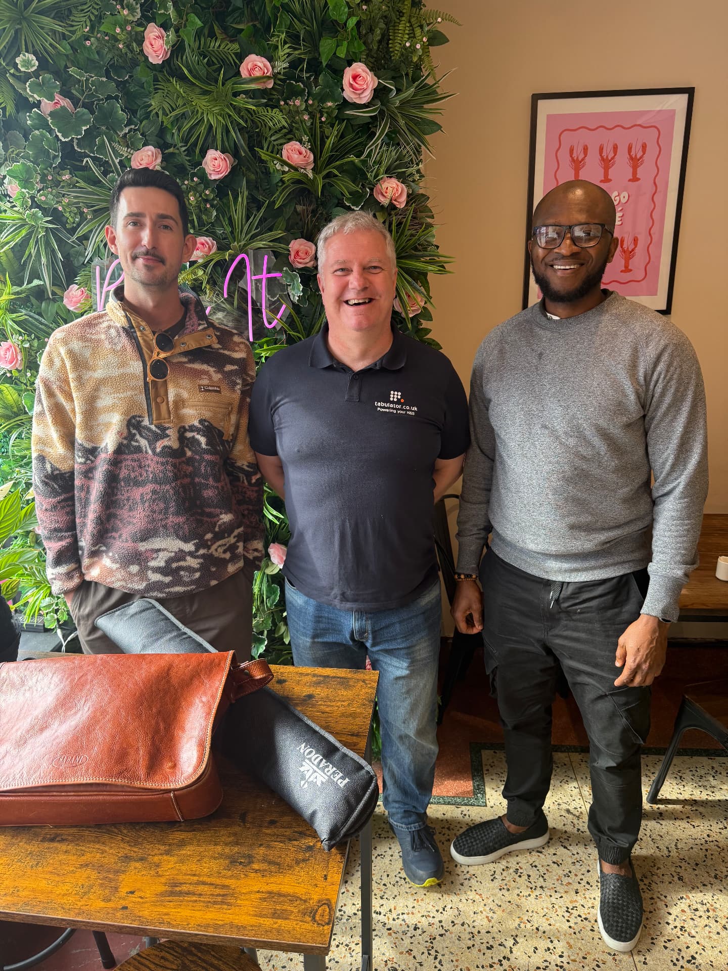 Three members standing together at a Growth Network coffee morning