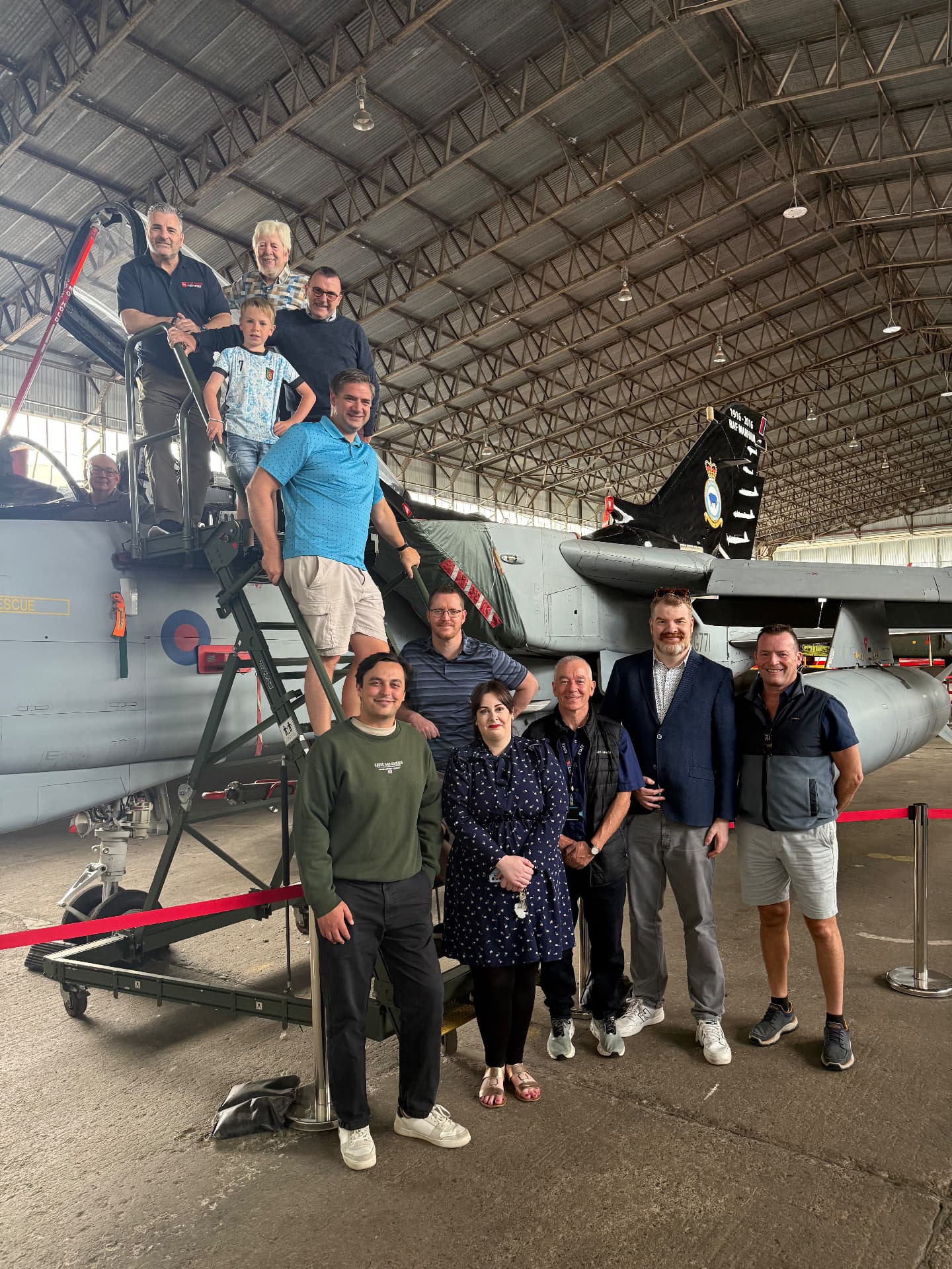 Growth Network members gathered together in an aircraft hangar at a recent visit